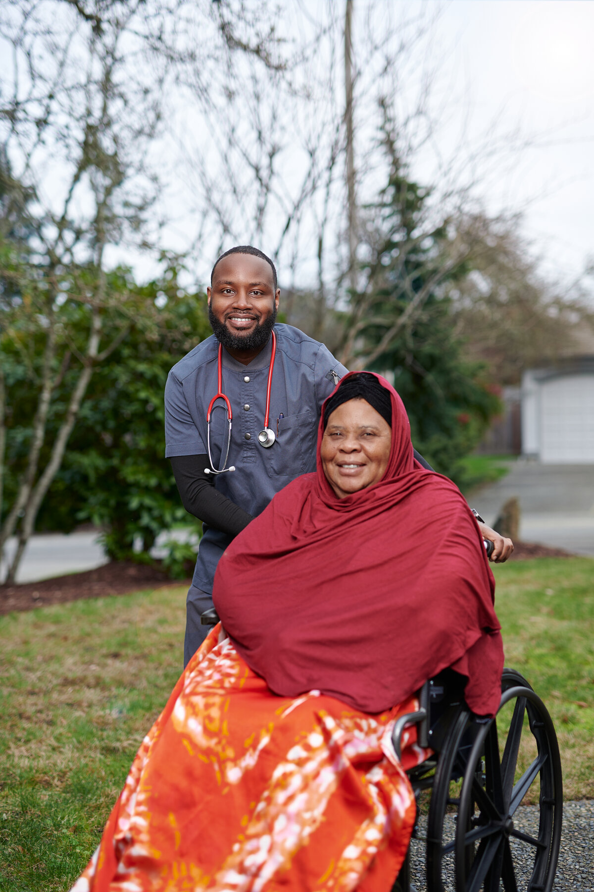 Caregiver with senior resident enjoying outdoor time in Seattle area